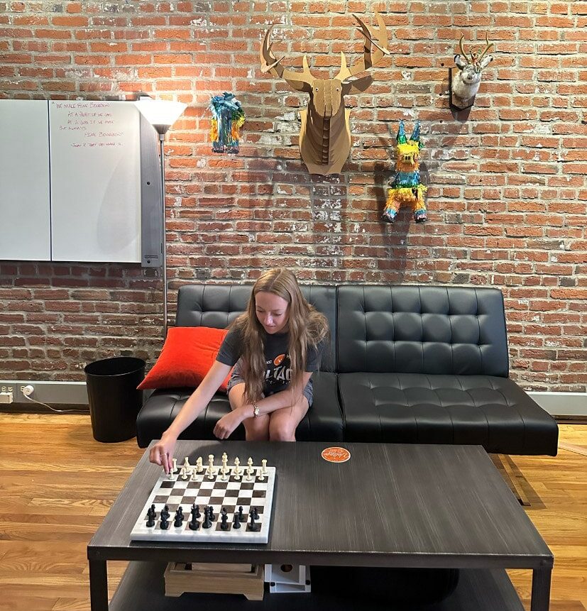 Intern Emily playing chess