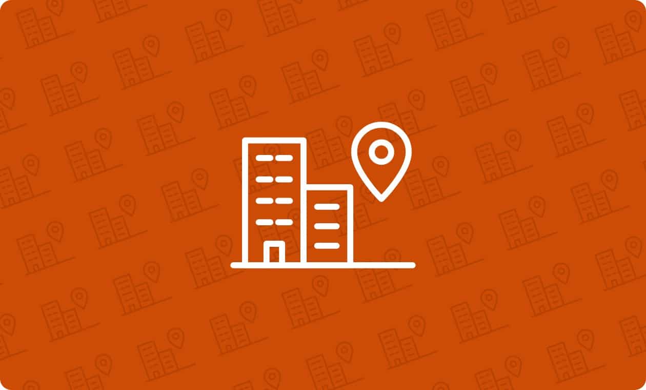 Line icon of office buildings with a map pin