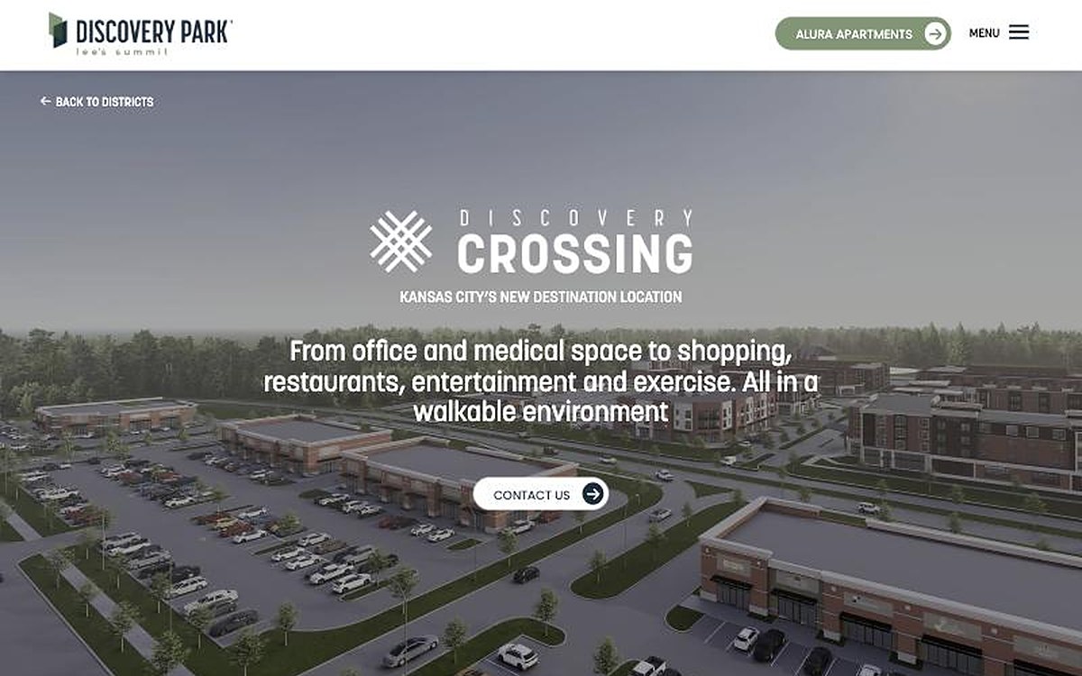 Discovery Park website page for Discovery Crossing, showing an aerial rendering of retail and office buildings at the Lee’s Summit development.