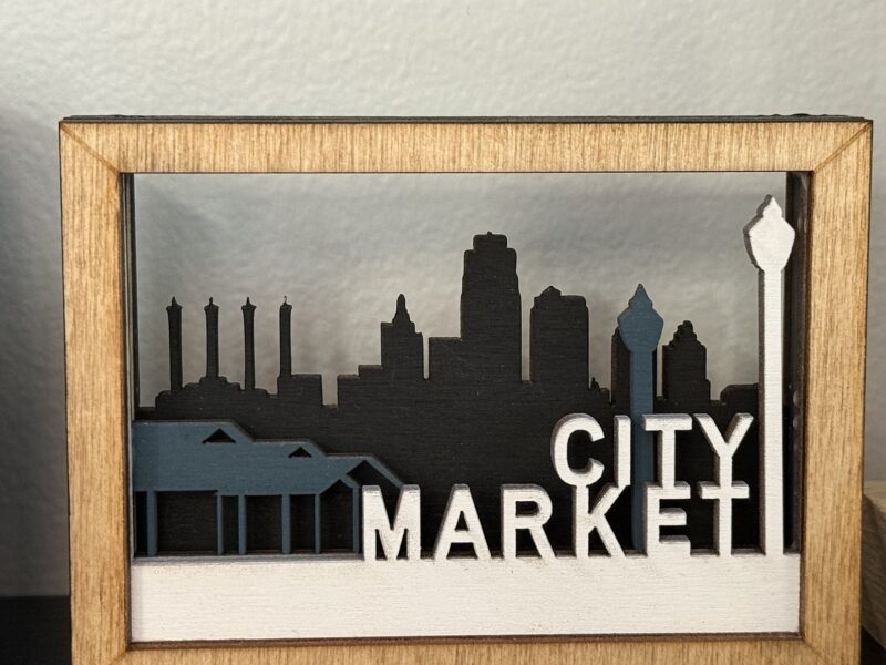 Laser-cut City Market and Kansas City skyline art in the VOLTAGE office